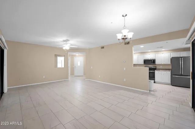 a view of a livingroom with a kitchen