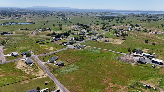 an aerial view of a residential houses with outdoor space