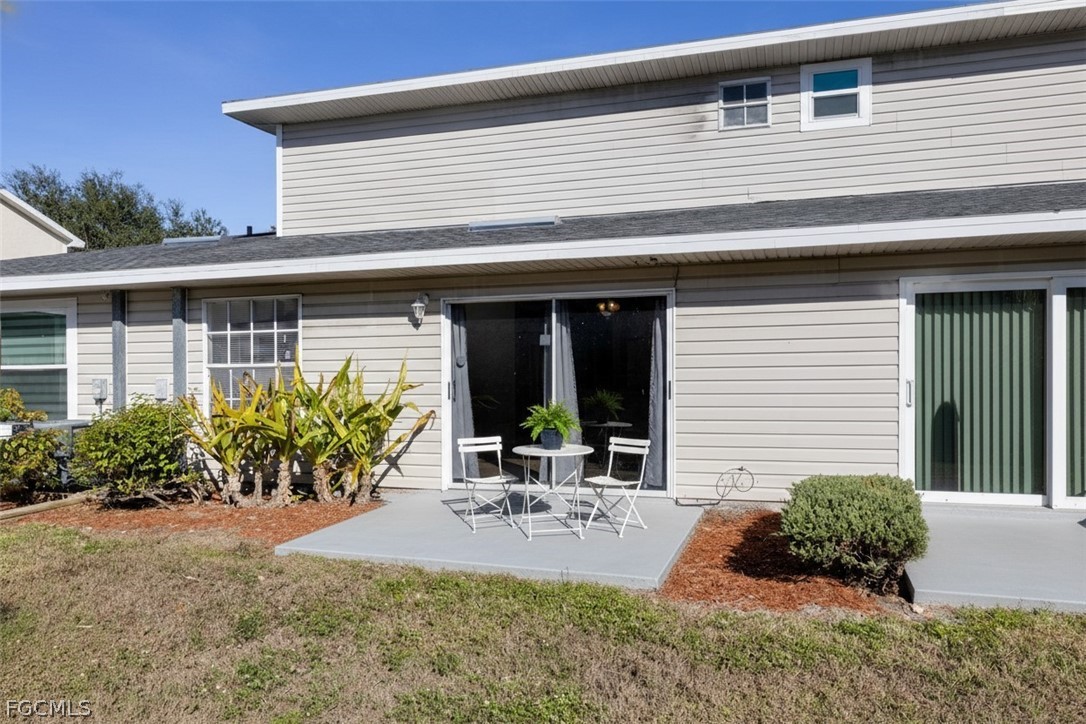 5304 Glenlivet Road Fort Myers, FL 33907 - Photo 15 of 19 a front view of a house with porch and furniture