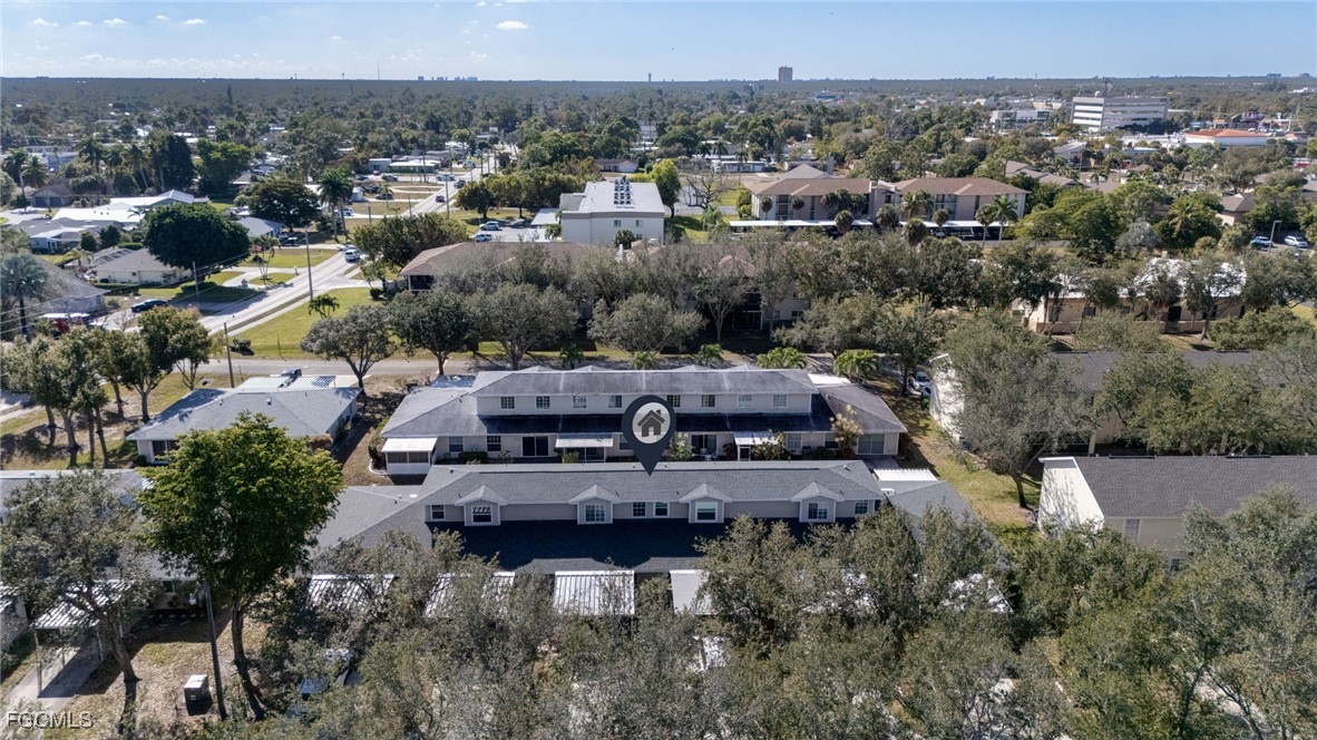 5304 Glenlivet Road Fort Myers, FL 33907 - Photo 18 of 19 an aerial view of a house with a garden and lake view