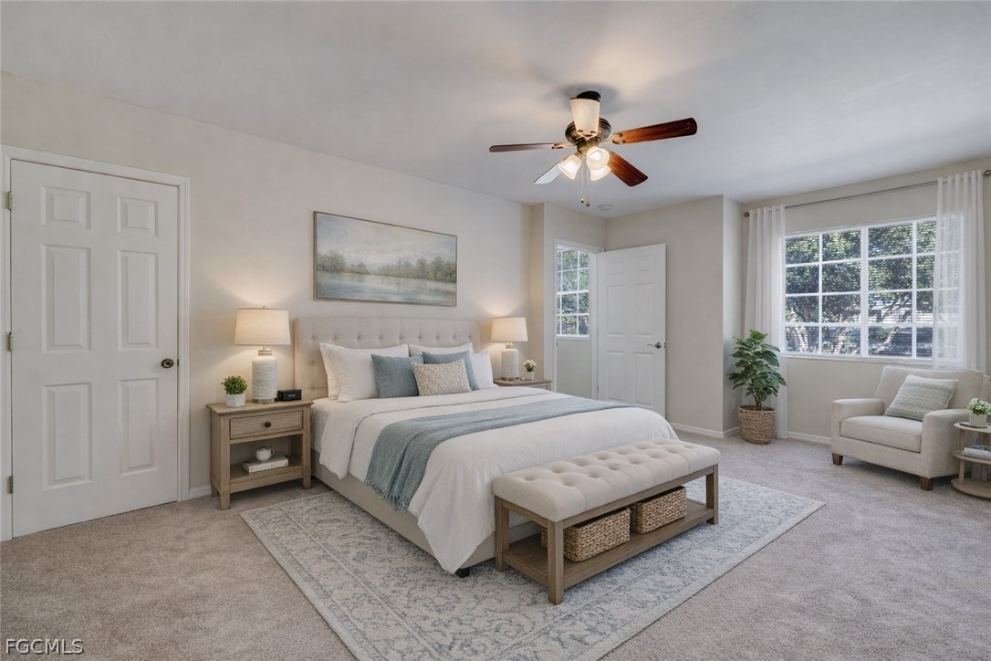 5304 Glenlivet Road Fort Myers, FL 33907 - Photo 7 of 19 a spacious bedroom with a bed a couch and window