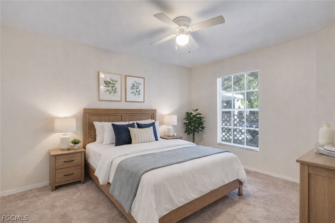 5304 Glenlivet Road Fort Myers, FL 33907 - Photo 10 of 19 a bedroom with a large bed and a window