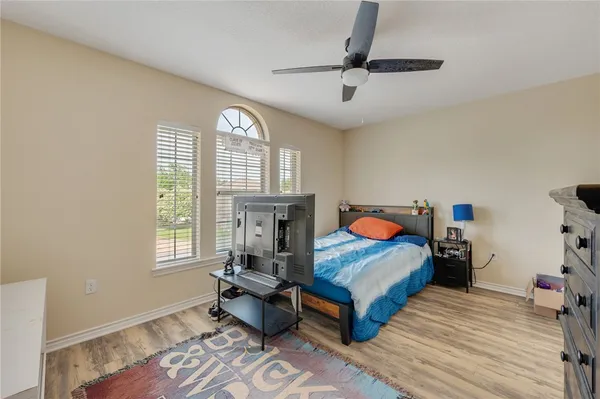 a bedroom with furniture and a window
