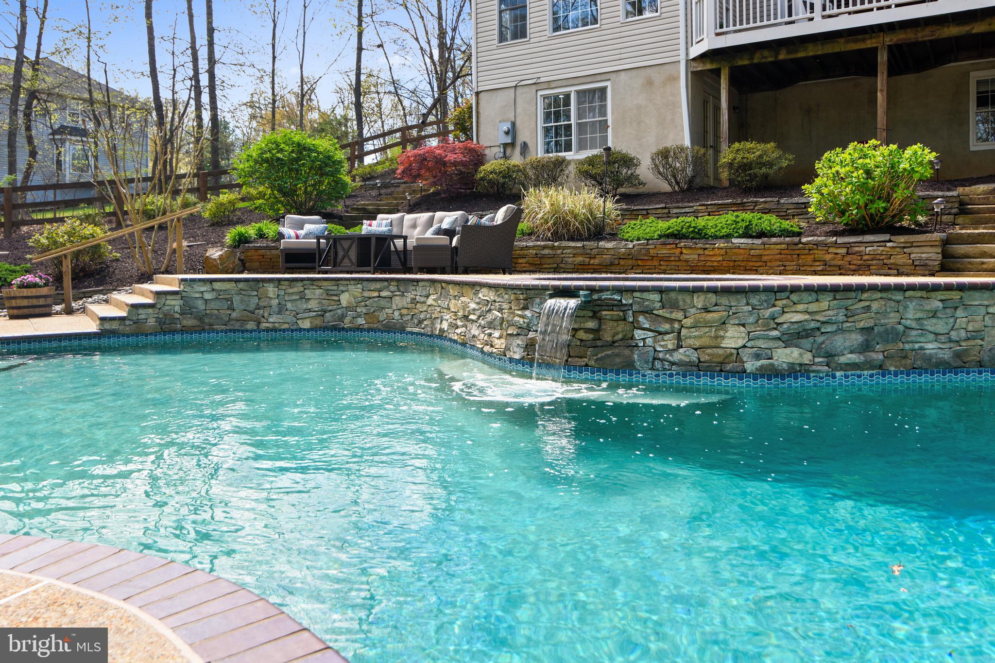 7173 Baldwin Ridge Road Warrenton, VA 20187 - Photo 84 of 113 spectacular waterfull and stone lined pool