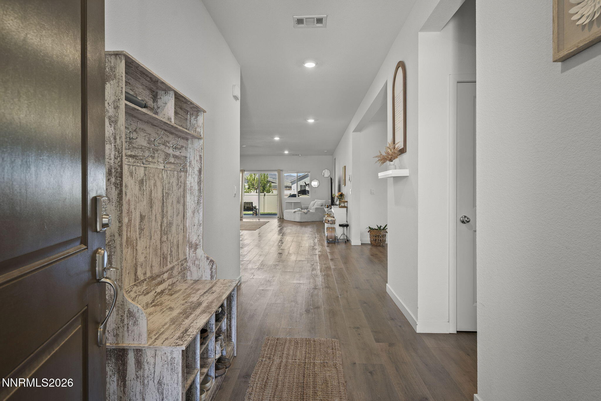 738 Butte Creek Road Dayton, NV 89403 - Photo 2 of 28 a hallway with wooden floor windows