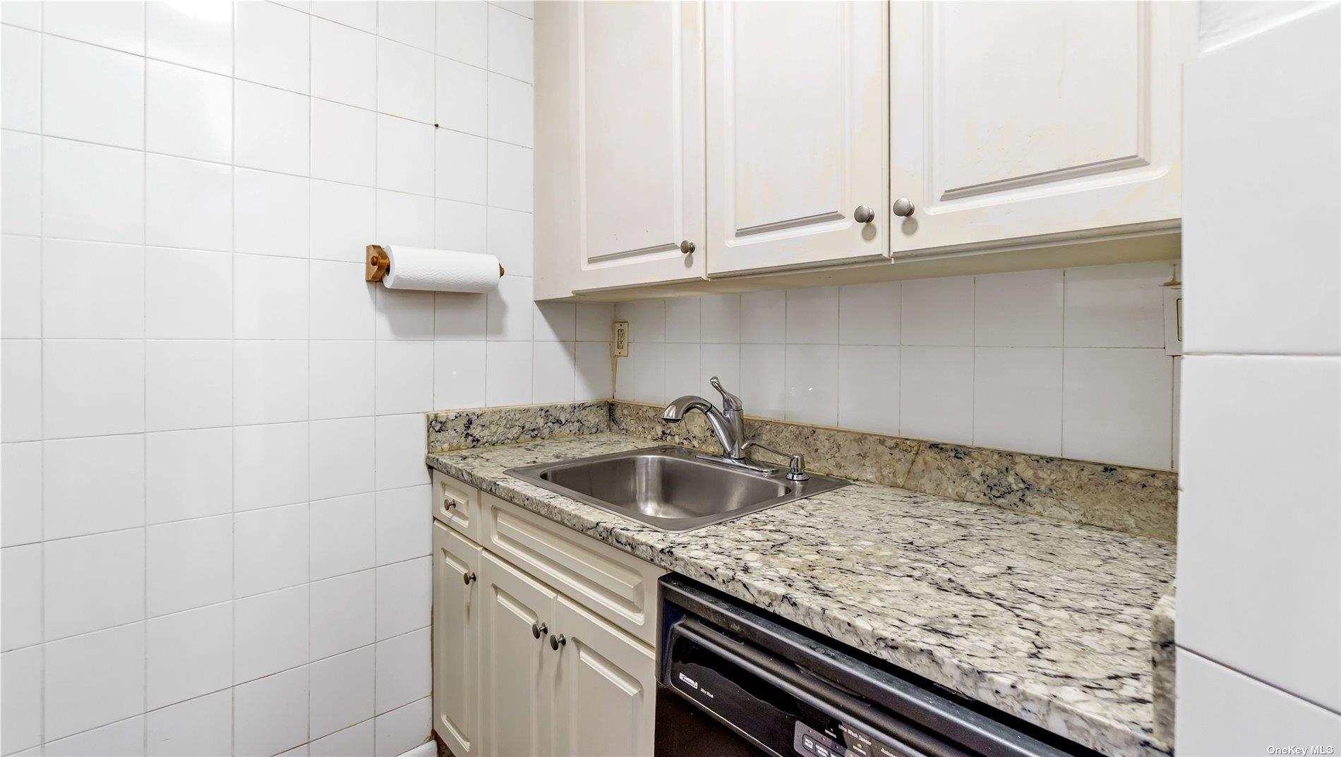 2400 Johnson Avenue, Unit 1B Bronx, NY 10463 - Photo 13 of 29 a kitchen with a sink and cabinets