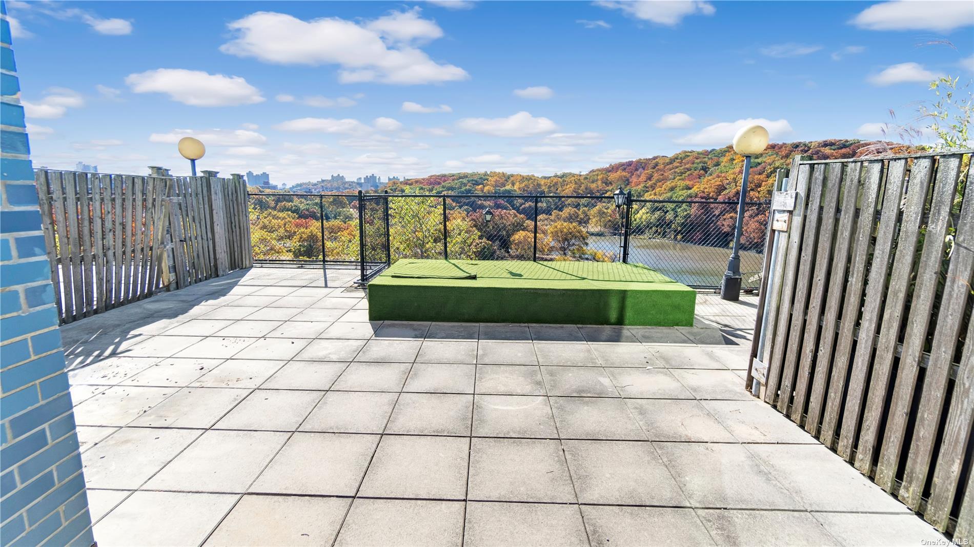 2400 Johnson Avenue, Unit 1B Bronx, NY 10463 - Photo 14 of 29 a terrace with a bench