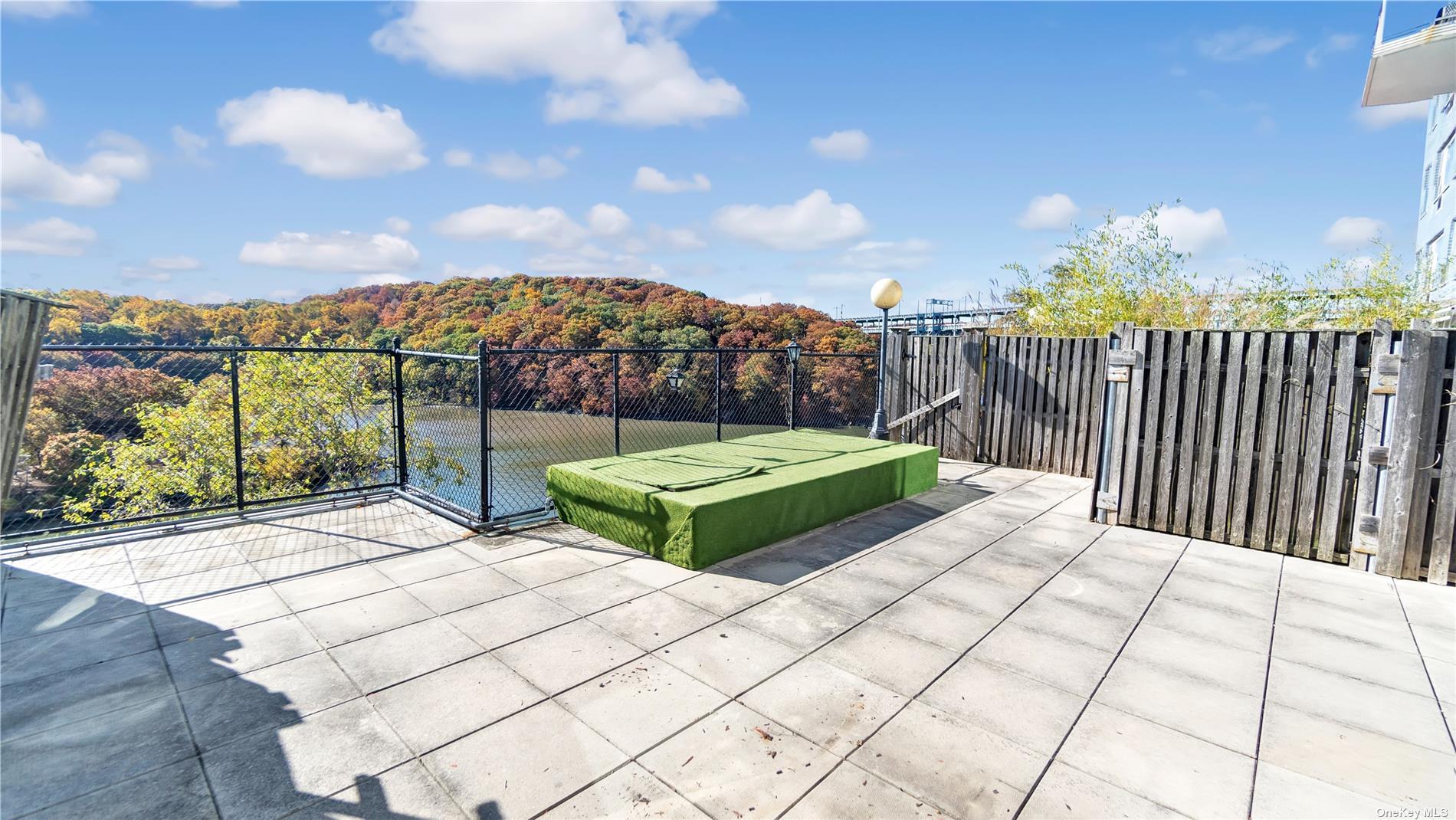 2400 Johnson Avenue, Unit 1B Bronx, NY 10463 - Photo 15 of 29 a view of a terrace with a garden