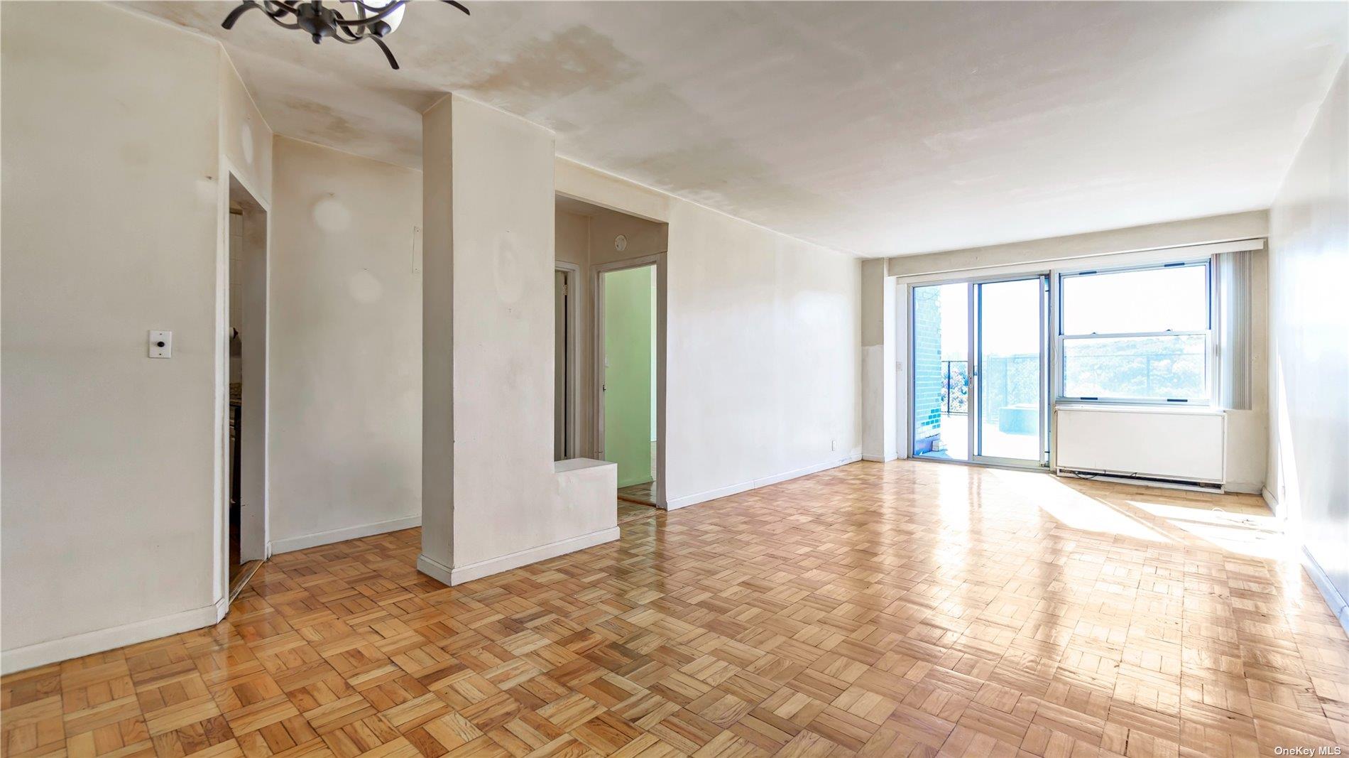 2400 Johnson Avenue, Unit 1B Bronx, NY 10463 - Photo 2 of 29 a view of an empty room with glass door