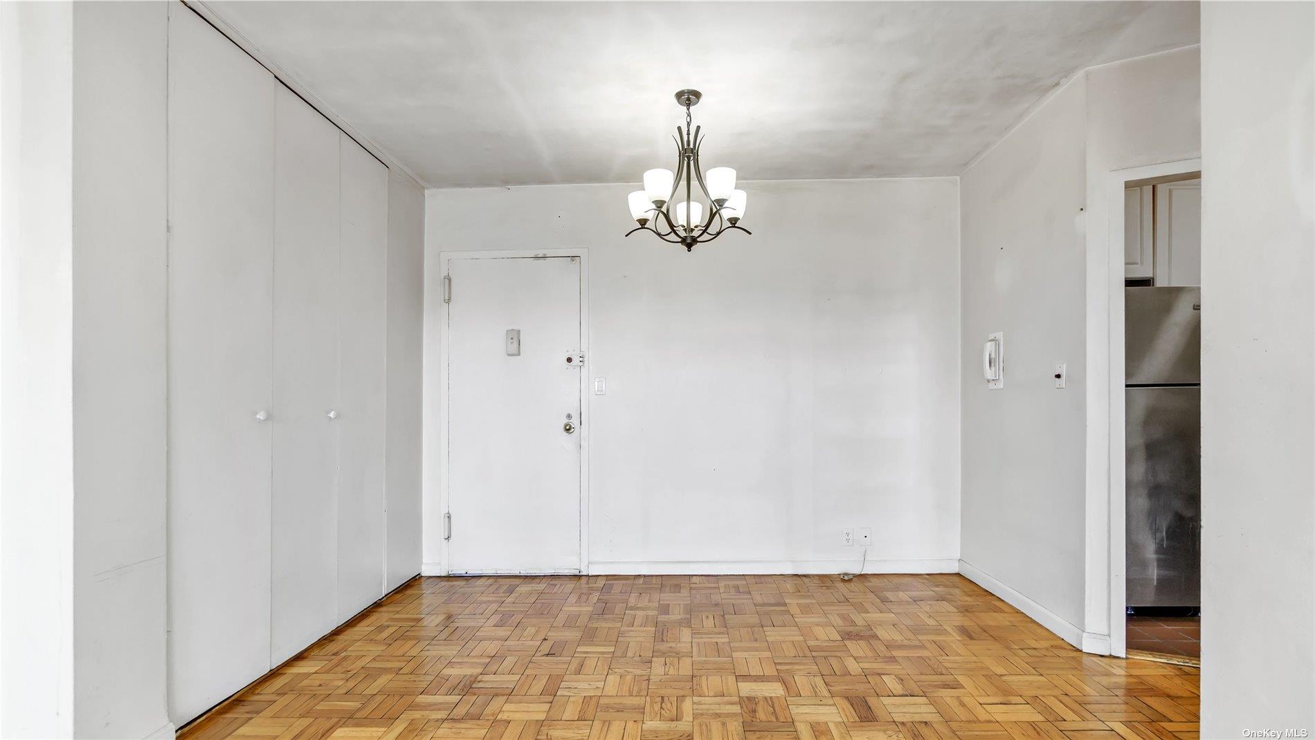 2400 Johnson Avenue, Unit 1B Bronx, NY 10463 - Photo 4 of 29 a view of a chandelier fan and entryway