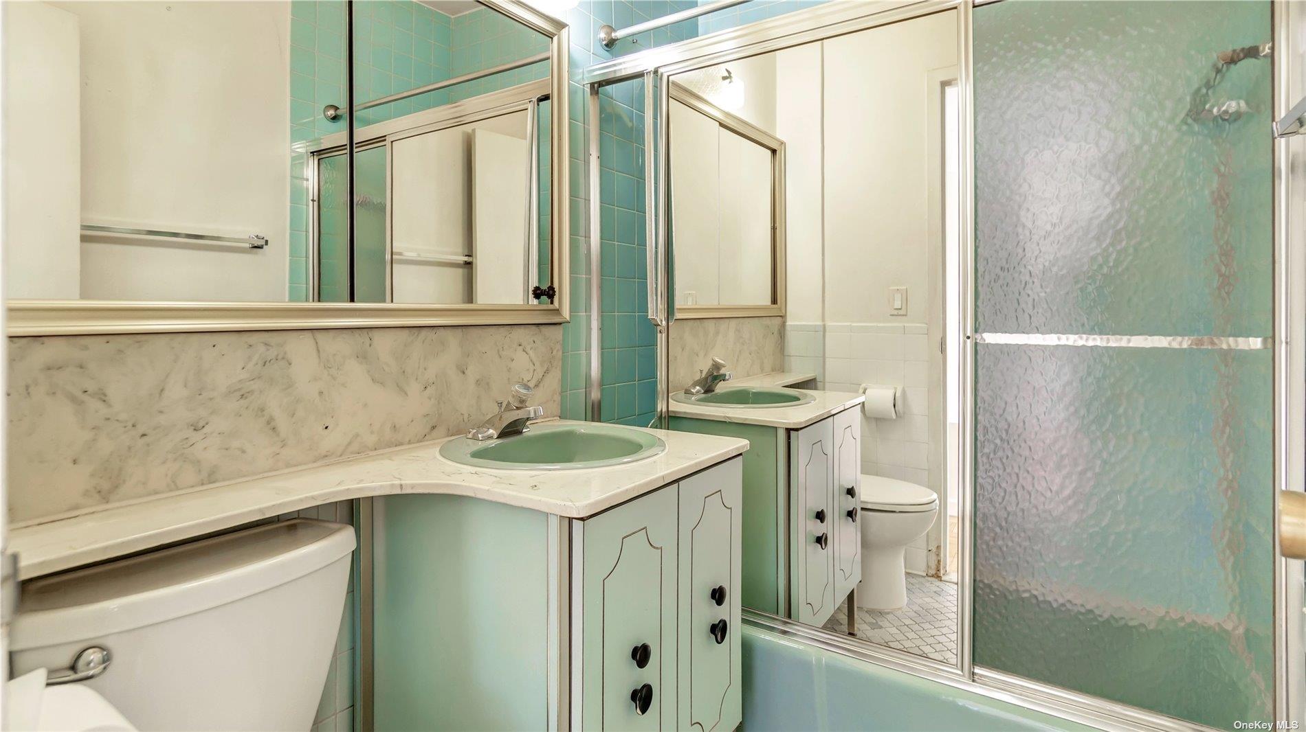 2400 Johnson Avenue, Unit 1B Bronx, NY 10463 - Photo 7 of 29 a bathroom with a sink and a mirror