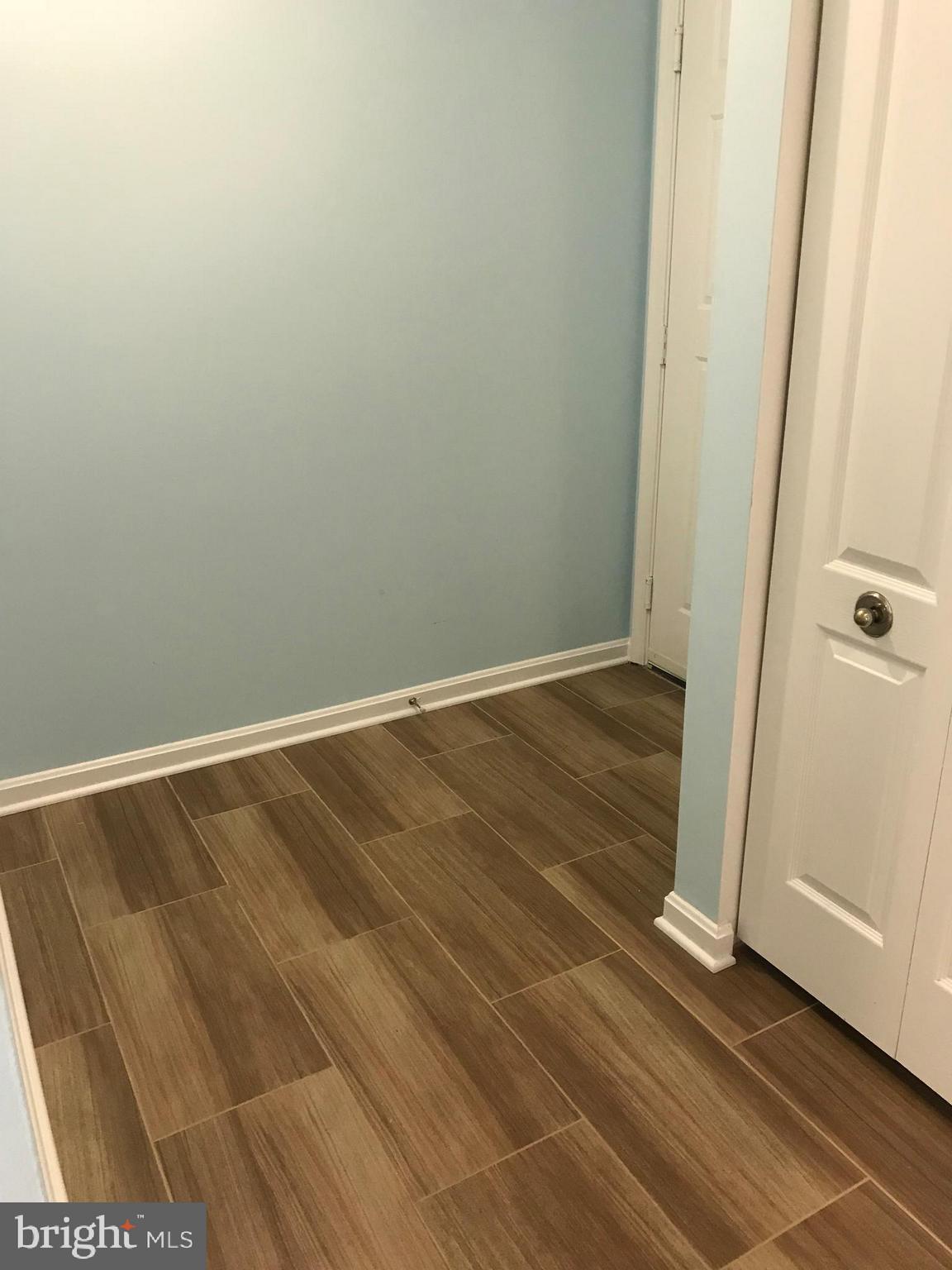 8591 Falls Run Road, Unit J Ellicott City, MD 21043 - Photo 2 of 16 Great new tile flooring!