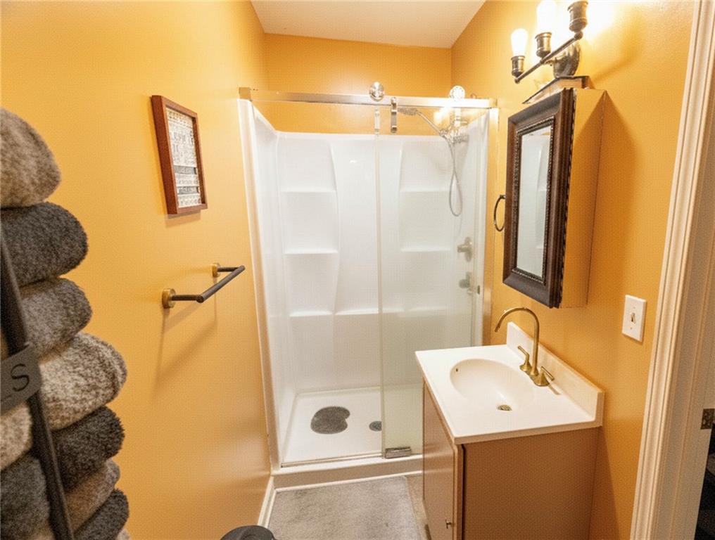 27 Hawks Trail Newborn, GA 30056 - Photo 12 of 29 a bathroom with a sink a toilet and shower