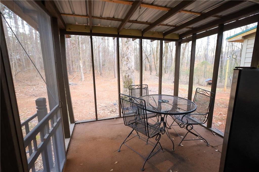 27 Hawks Trail Newborn, GA 30056 - Photo 16 of 29 a view of a room with furniture and large windows