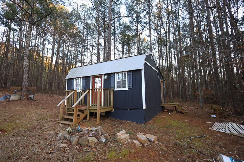 27 Hawks Trail Newborn, GA 30056 - Photo 17 of 29 a view of a house with a yard and large tree