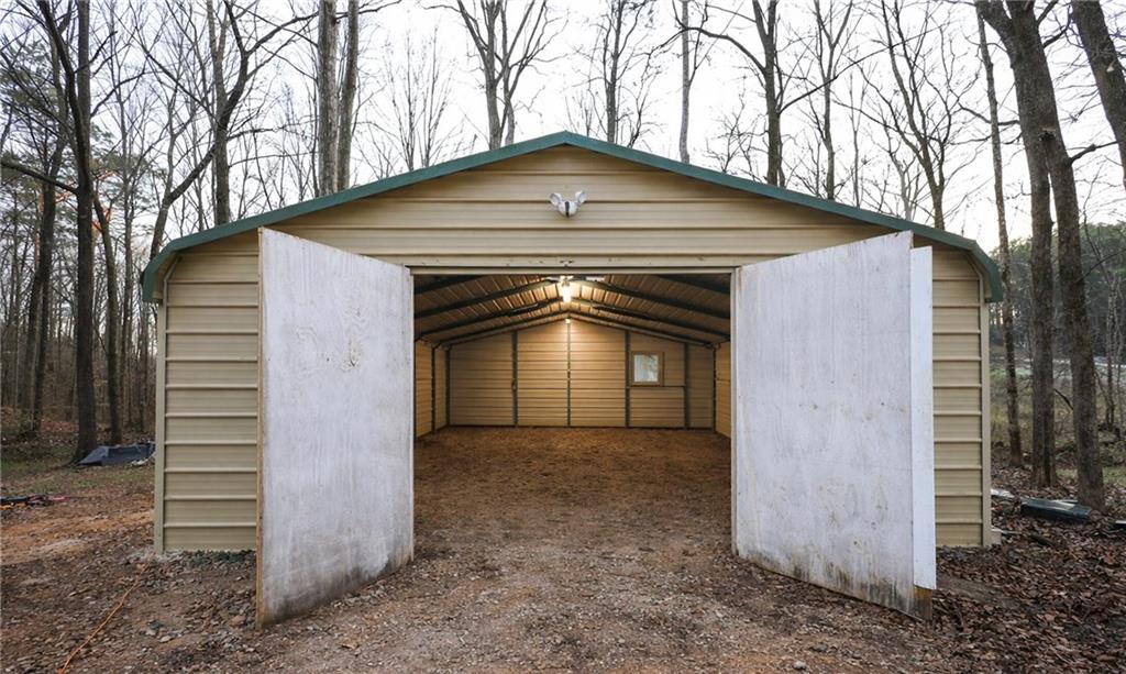 27 Hawks Trail Newborn, GA 30056 - Photo 4 of 29 a front view of a house with a yard and garage