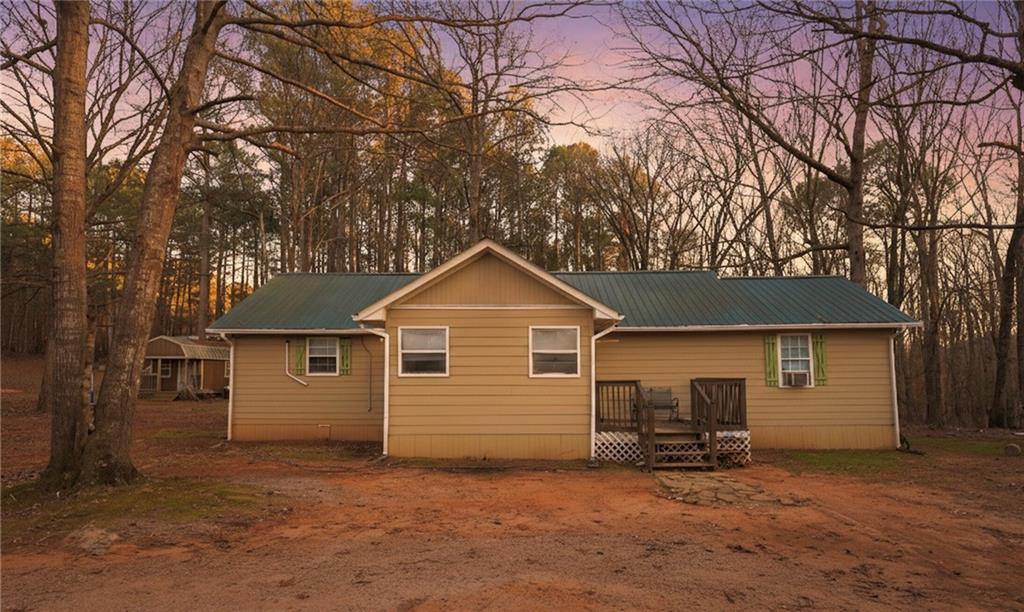27 Hawks Trail Newborn, GA 30056 - Photo 6 of 29 a view of a house with a yard and large tree