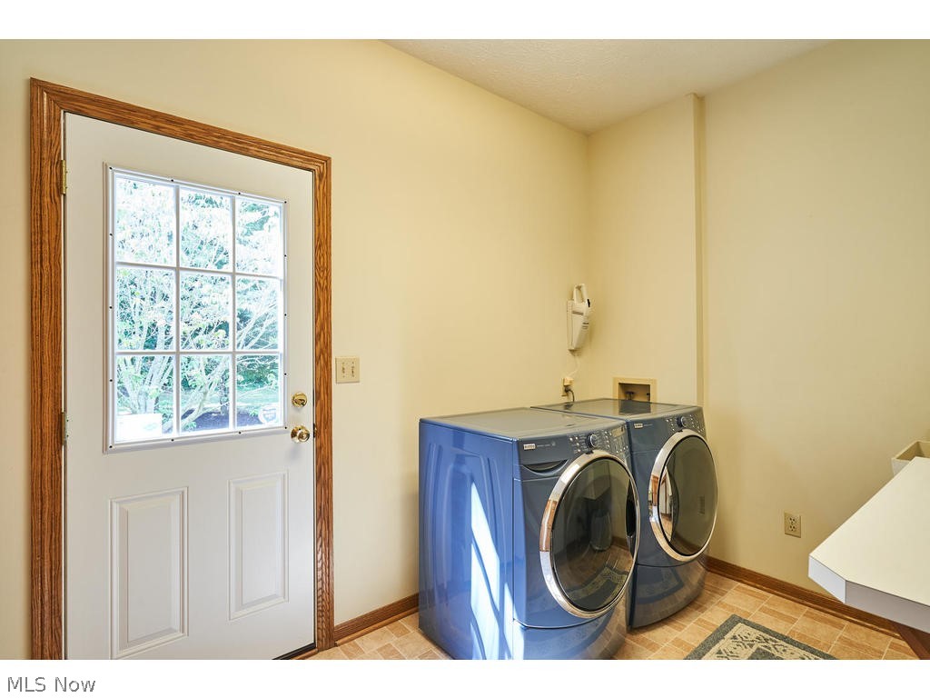 2460 Shadow Ridge Lane Fairlawn, OH 44333 - Photo 16 of 29 First floor laundry with double closet and access door to the back yard