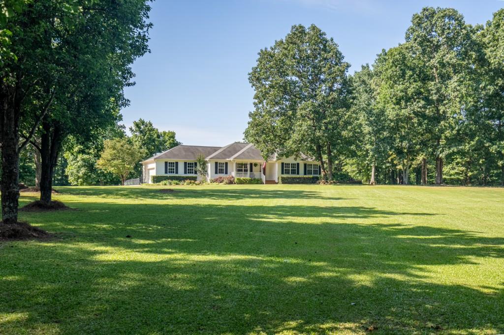 520 Campbell Road Cedartown, GA 30125 - Photo 1 of 1 a front view of a house with a garden