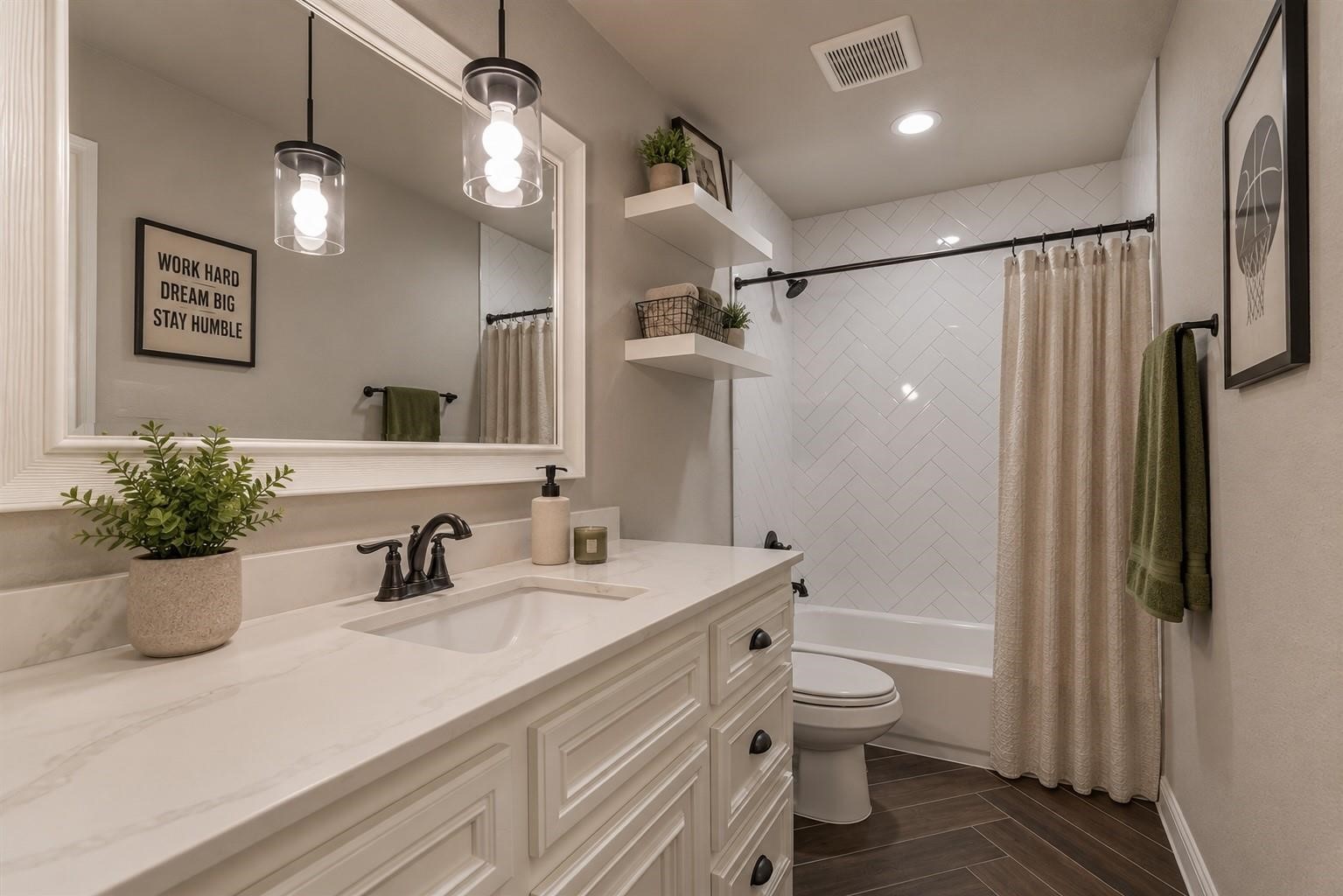 11618 Renaissance Drive Montgomery, TX 77356 - Photo 32 of 47 The full bath upstairs features the same designer finishes and coordinating tile patterns found throughout the home, maintaining a cohesive and elevated look. Virtually staged.