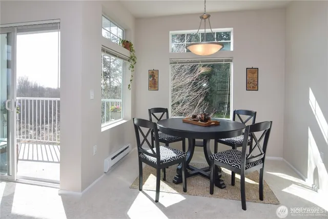 a dining room with furniture and window