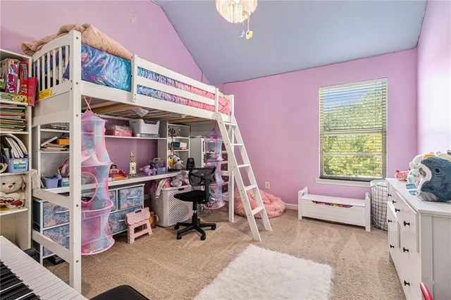 a bedroom with furniture and a window