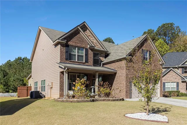 a front view of a house with a yard