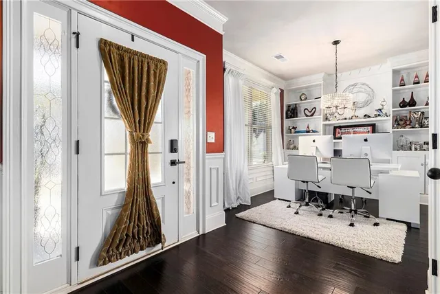 a view of a livingroom with furniture and hardwood floor