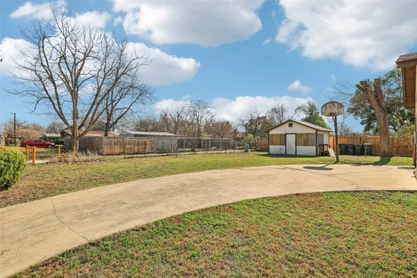 a view of a house with swimming pool and sitting area