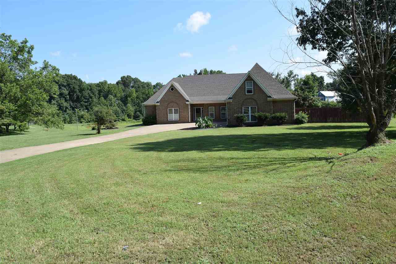6546 Tracy Road Atoka, TN 38004 - Photo 1 of 24 a front view of a house with a yard