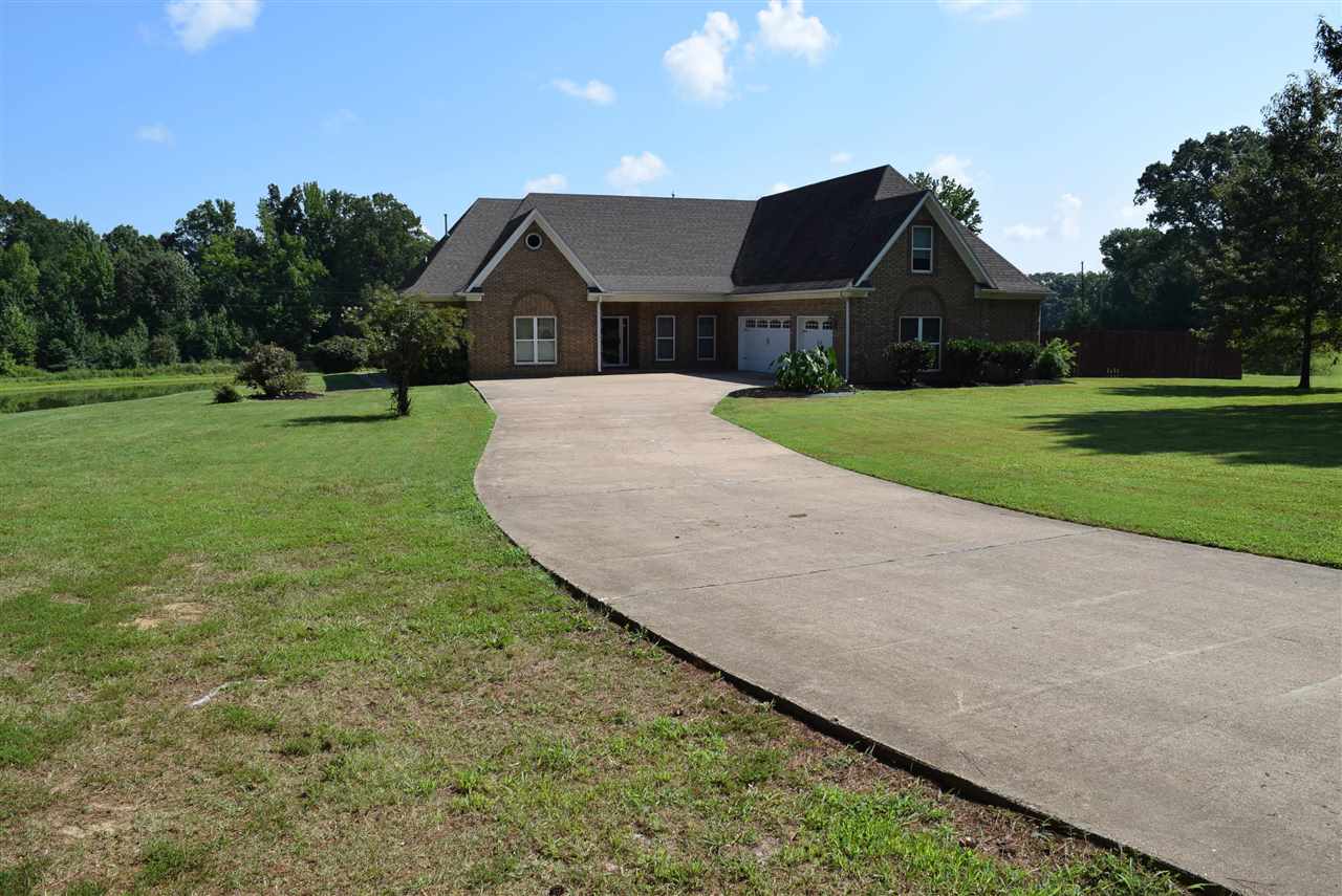 6546 Tracy Road Atoka, TN 38004 - Photo 2 of 24 a front view of house with yard and green space