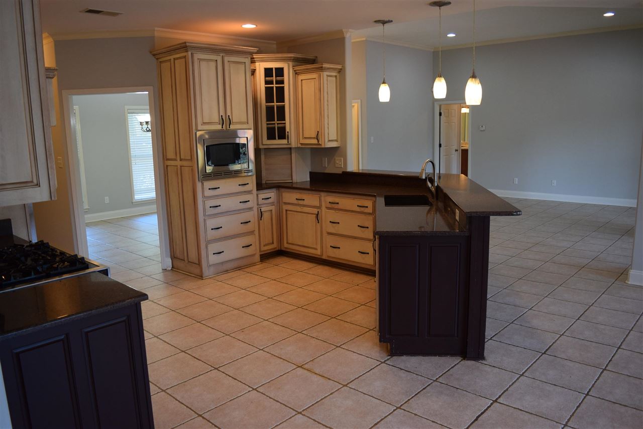 6546 Tracy Road Atoka, TN 38004 - Photo 12 of 24 a kitchen with a sink and cabinets
