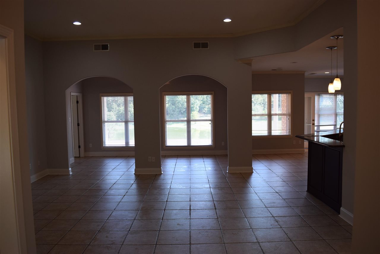 6546 Tracy Road Atoka, TN 38004 - Photo 14 of 24 a view of empty room with windows and wooden floor