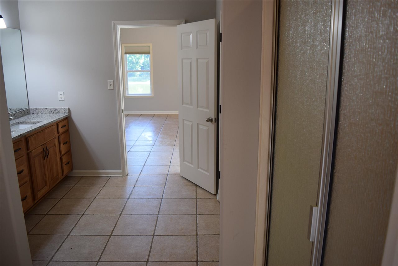 6546 Tracy Road Atoka, TN 38004 - Photo 20 of 24 a view of a kitchen from the hallway
