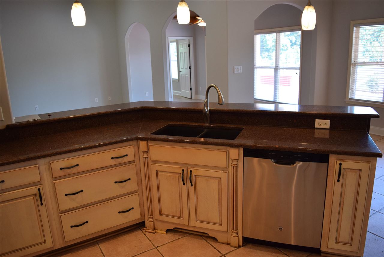 6546 Tracy Road Atoka, TN 38004 - Photo 10 of 24 a kitchen with a sink and cabinets