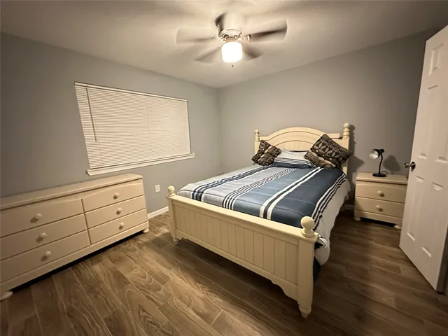 a bedroom with a bed and a dresser