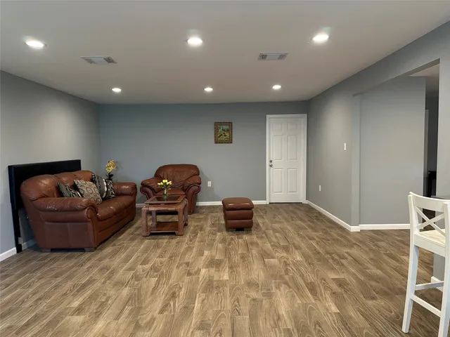 a living room with furniture and a couch
