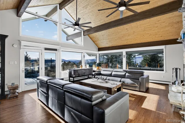 a bedroom with furniture and a flat screen tv