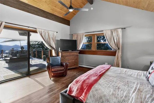 a en suite bathroom with a tub shower and mirror