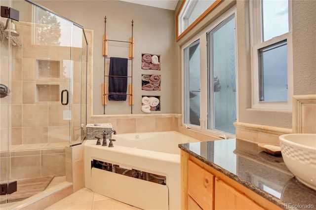 a view of roof deck with furniture