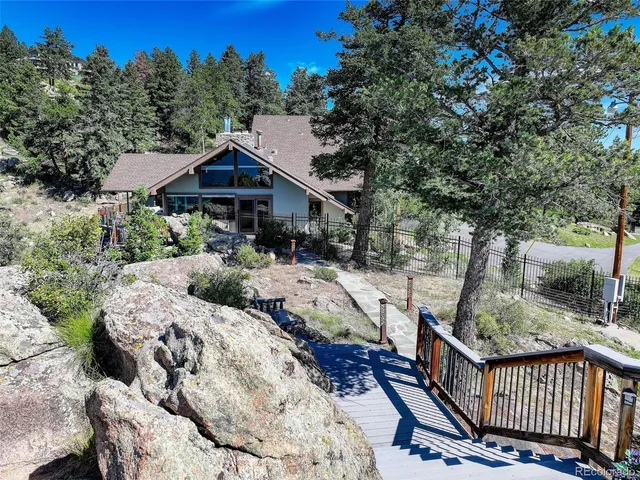 a view of a wooden dinning table and chairs