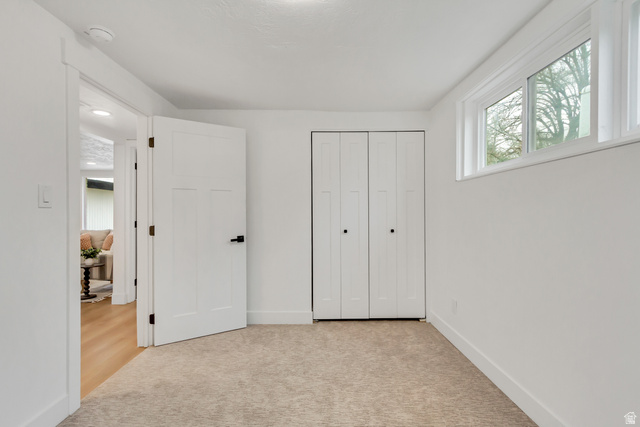 337 West 2900th Street South Bountiful, UT 84010 - Photo 8 of 35 Unfurnished bedroom featuring light colored carpet and a closet