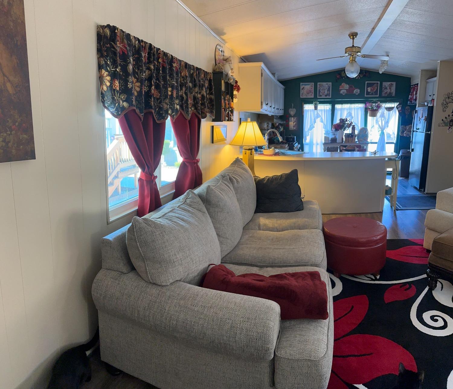 2933 Forebay Road, Unit 10 Pollock Pines, CA 95726 - Photo 12 of 28 a living room with furniture a flat screen tv and a window