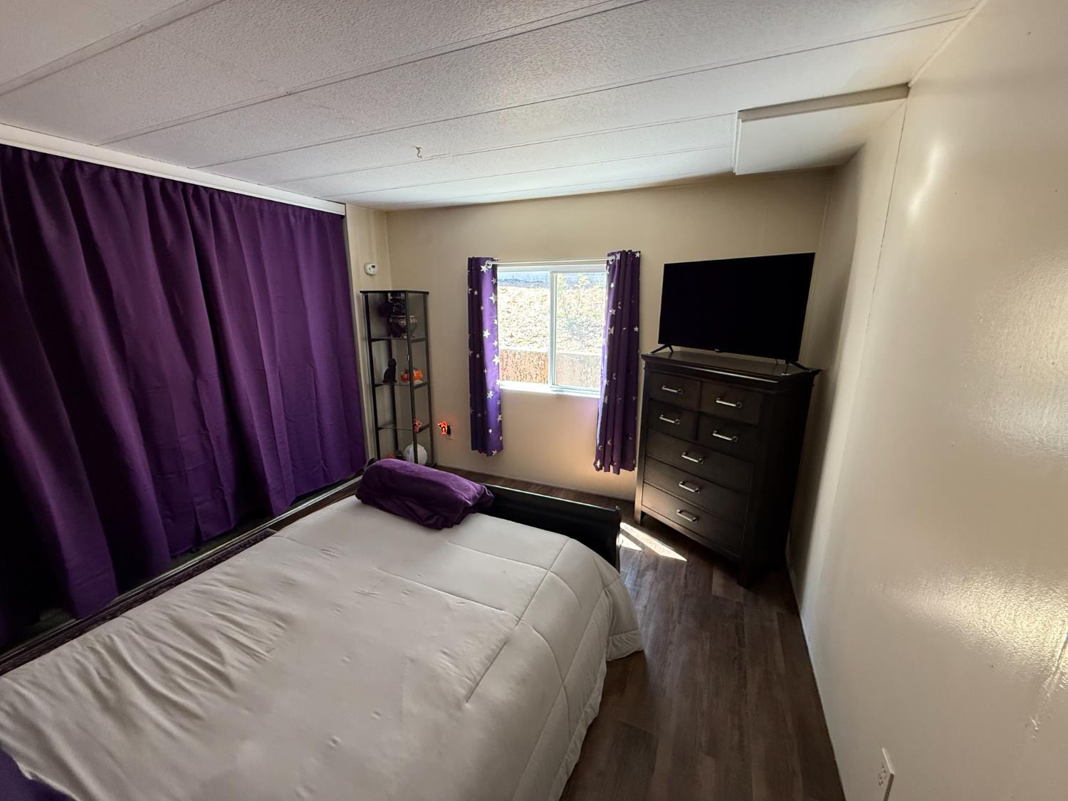 2933 Forebay Road, Unit 10 Pollock Pines, CA 95726 - Photo 15 of 28 a bedroom with a bed and a television