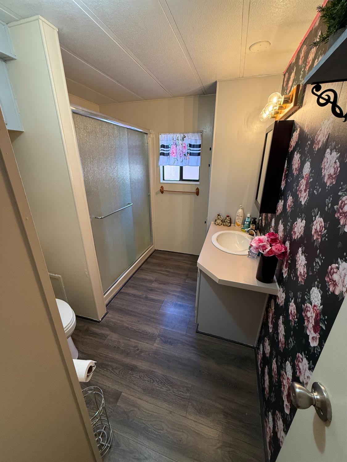 2933 Forebay Road, Unit 10 Pollock Pines, CA 95726 - Photo 17 of 28 a bathroom with a sink mirror and vanity