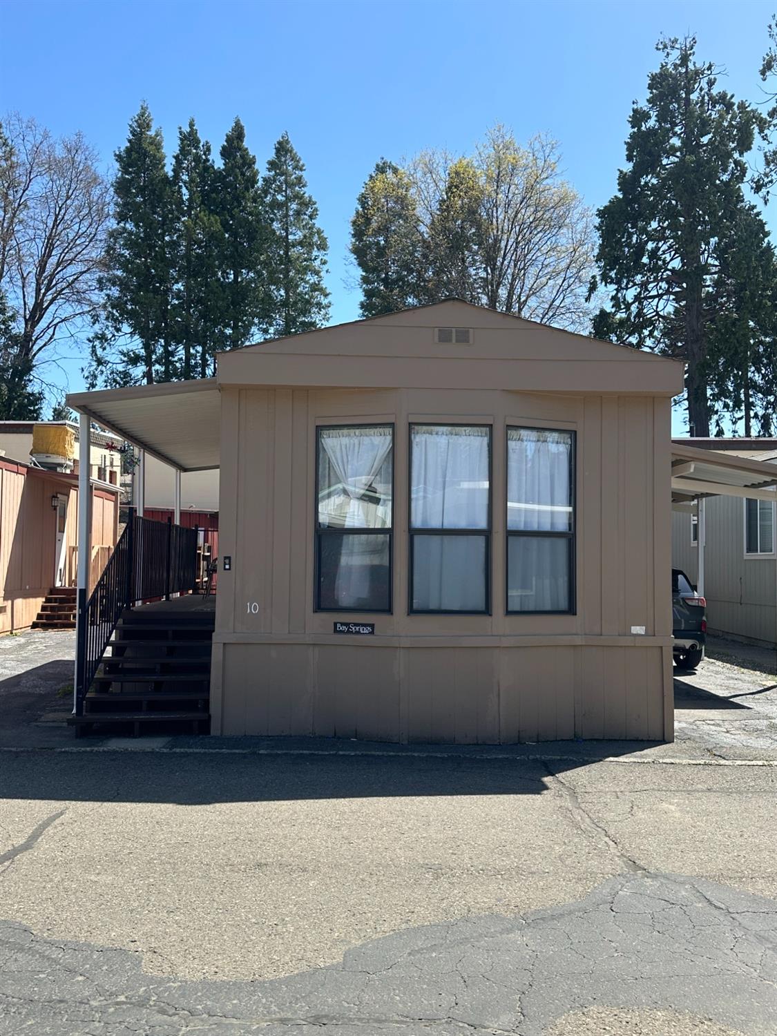 2933 Forebay Road, Unit 10 Pollock Pines, CA 95726 - Photo 2 of 28 a front view of a house with a yard