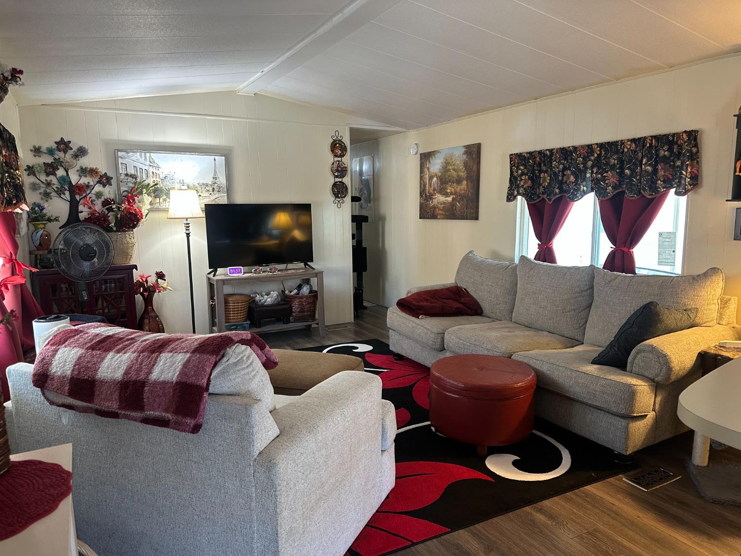 2933 Forebay Road, Unit 10 Pollock Pines, CA 95726 - Photo 8 of 28 a living room with furniture and a flat screen tv