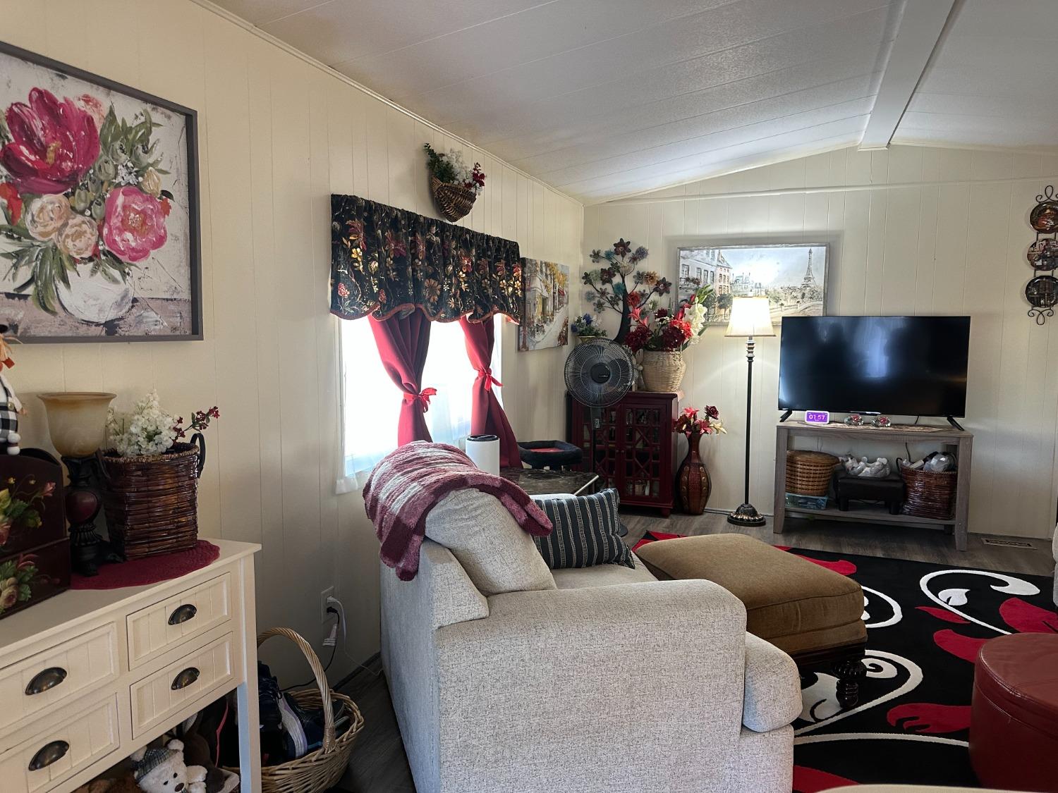 2933 Forebay Road, Unit 10 Pollock Pines, CA 95726 - Photo 9 of 28 a bedroom with furniture and a flat screen tv