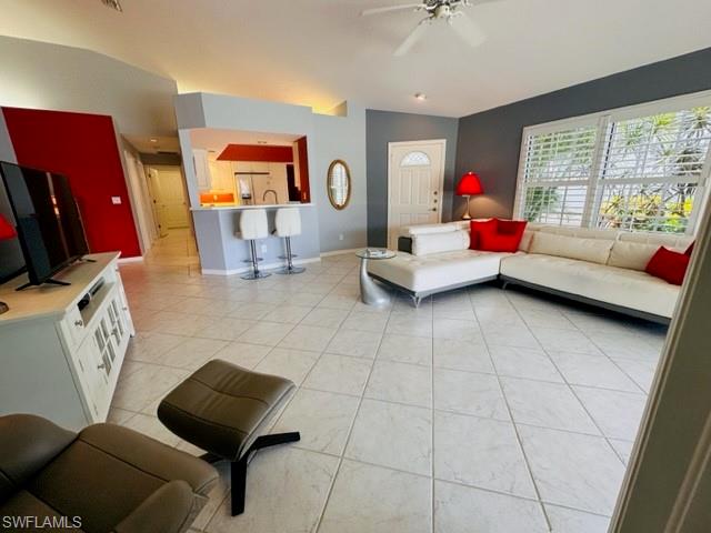 224 Napa Ridge Road East, Unit 12 Naples, FL 34119 - Photo 13 of 33 a living room with furniture and a window
