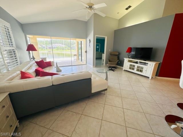 224 Napa Ridge Road East, Unit 12 Naples, FL 34119 - Photo 15 of 33 a living room with furniture and a flat screen tv